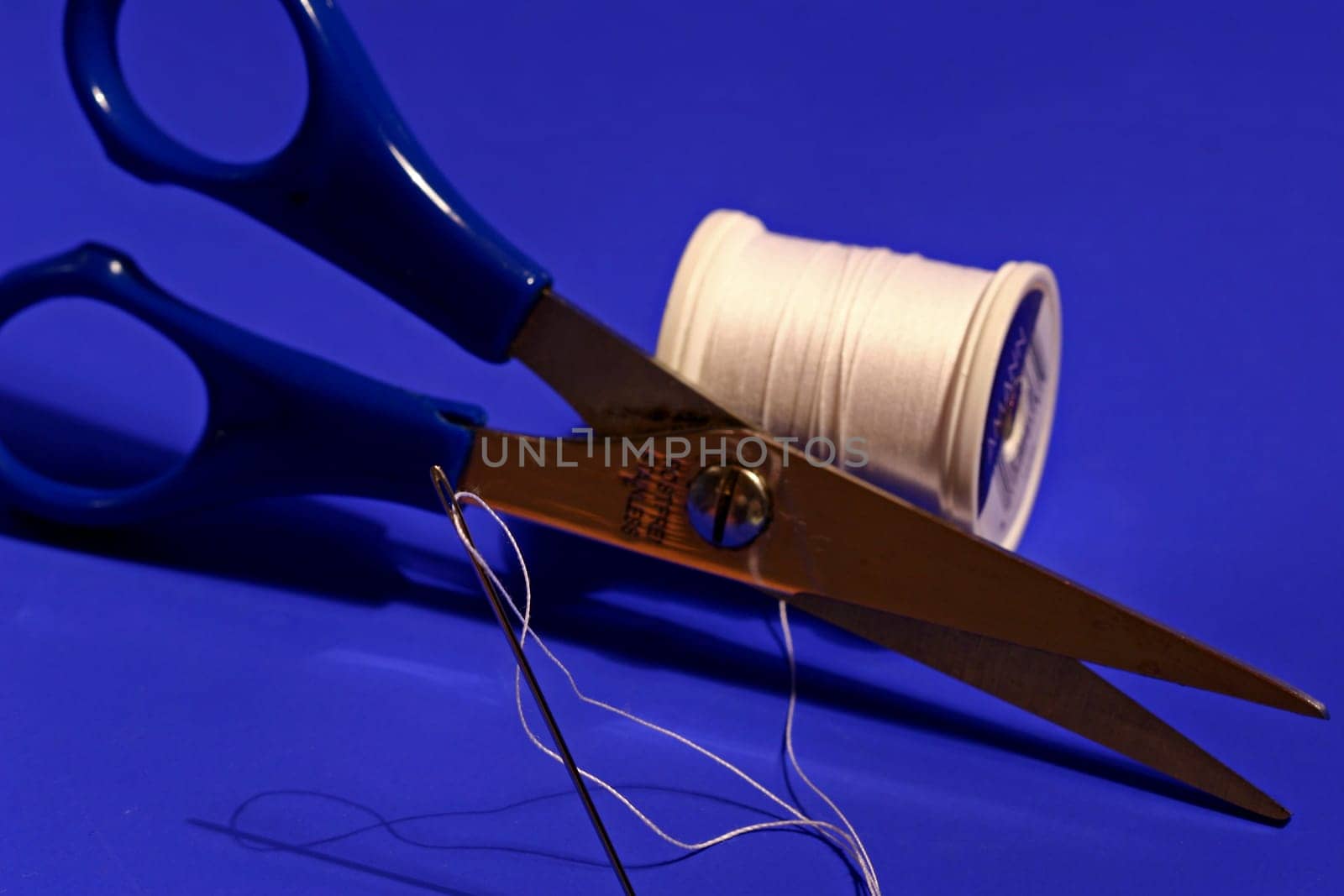 Needle,thread,scissors