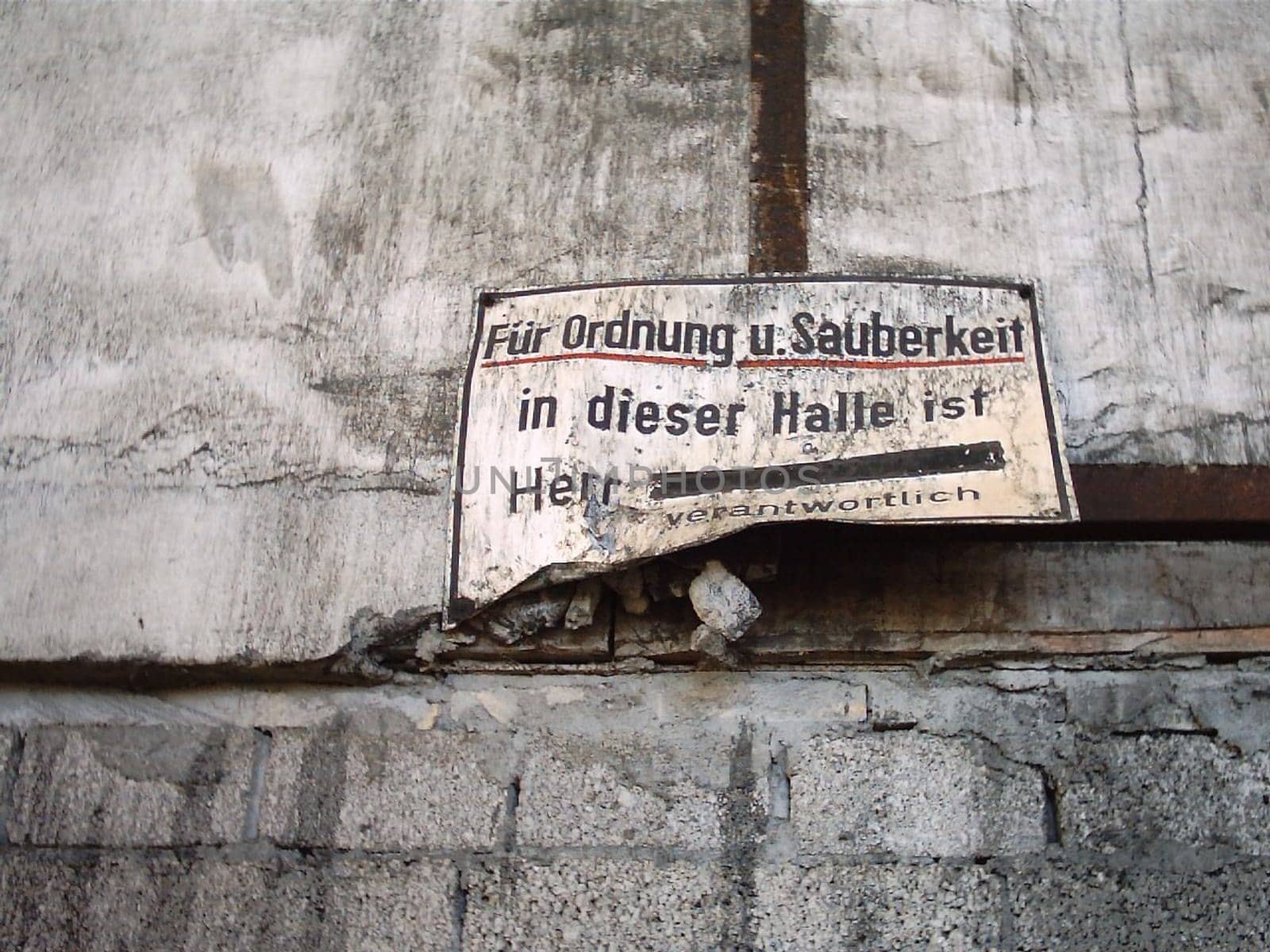 Sign in an abandoned industrial hall. By the way,the name was already crossed out -)