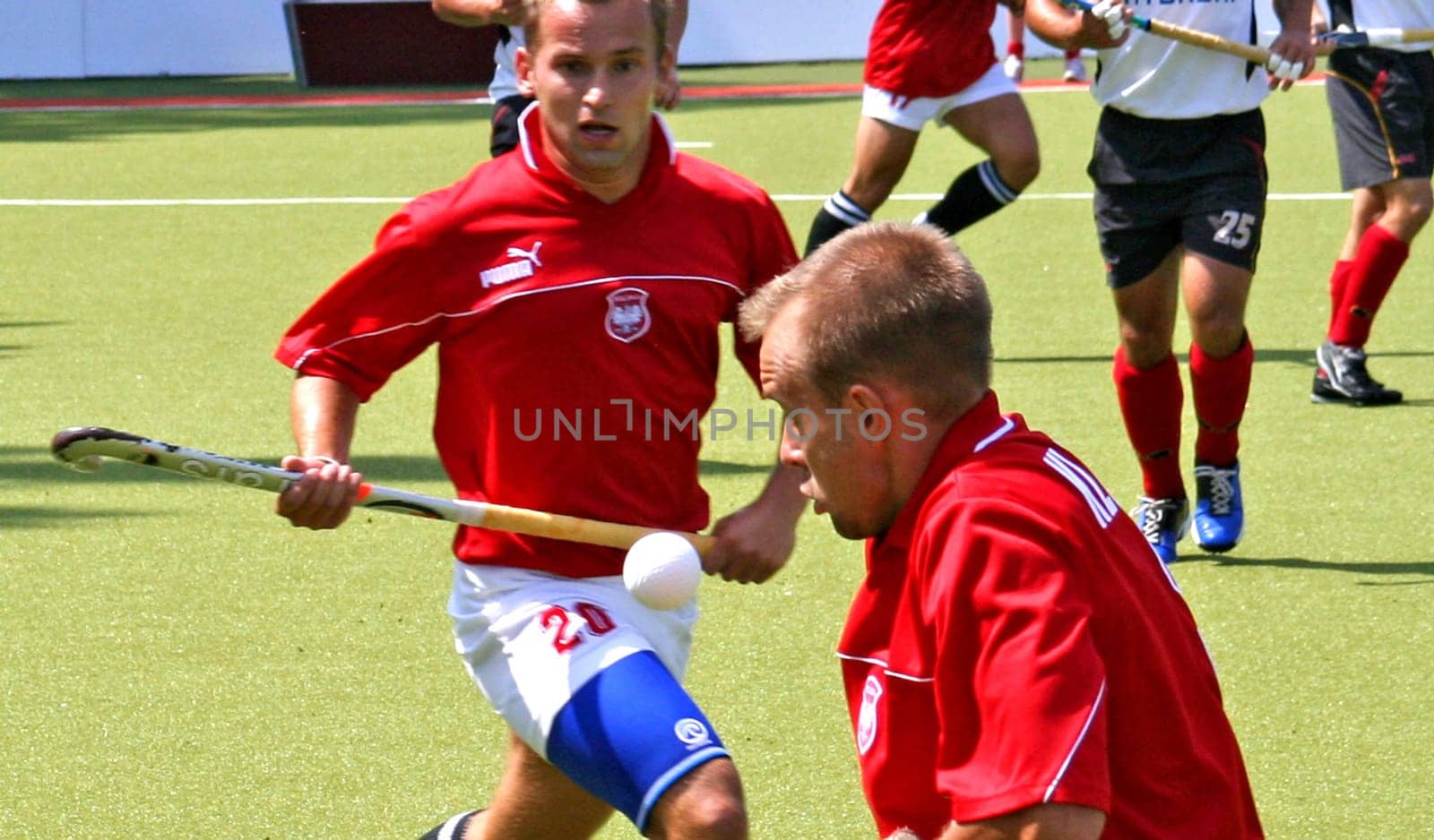 The picture was taken on 24.07.05 at the international hockey match between Germany and Poland. Final score 5:0 for Germany. The image has been severely cropped. In the foreground you can see the Polish player Kluczynski.