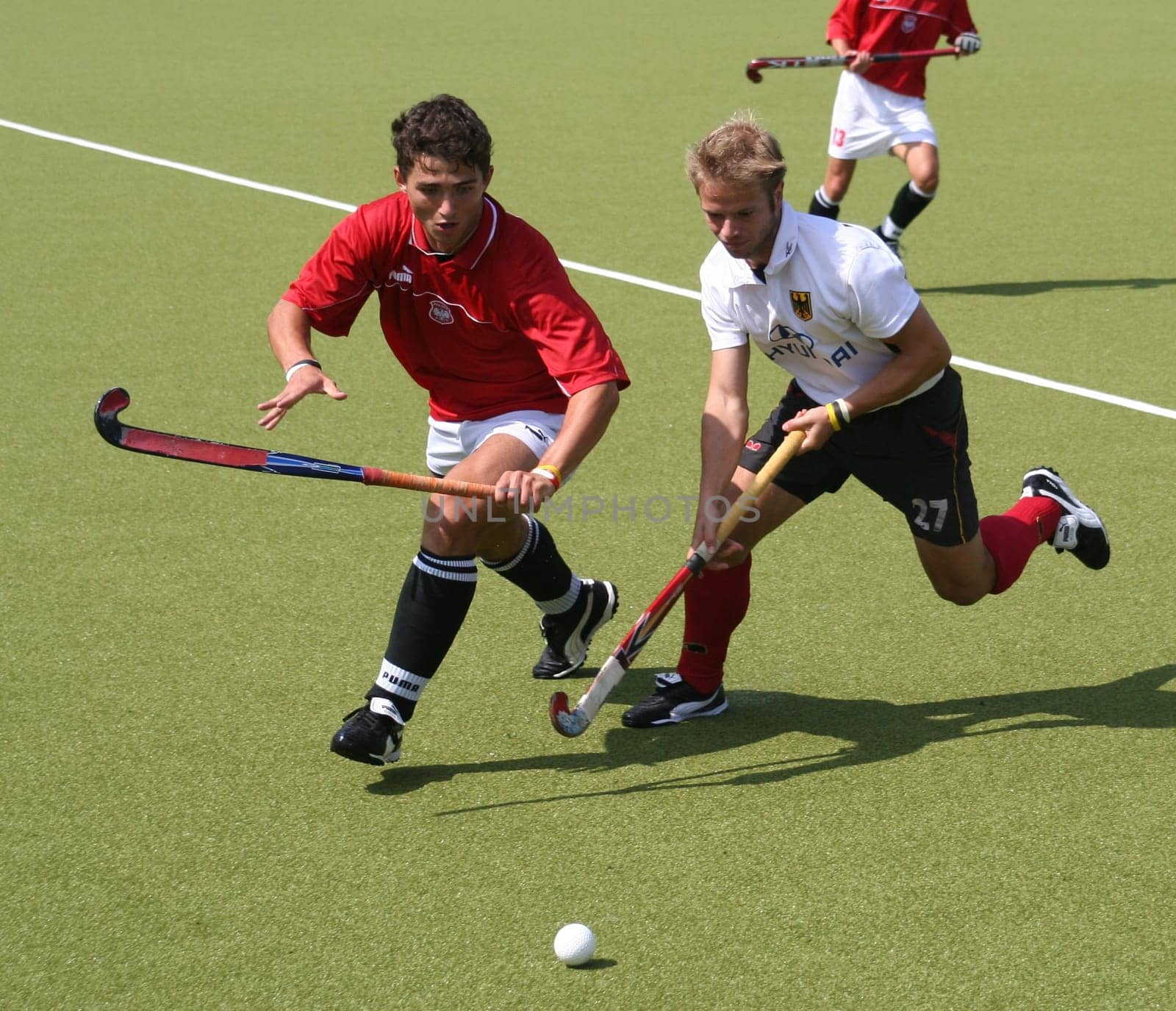 The picture was taken on 24.07.05 at the international hockey match between Germany and Poland. Final score 5:0 for Germany. With the No. 27 the German player Oliver Markowsky,who plays for the Rüsselsheimer RK