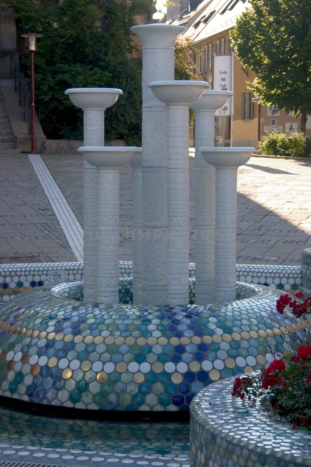 The porcelain fountain in the city of porcelain - Selb,Martin-Luther-Platz. The porcelain fountain,redesigned in 2003 by the porcelain manufactory Barbara Flügel,which sets a striking spotlight in fresh blue and turquoise tones and its ed