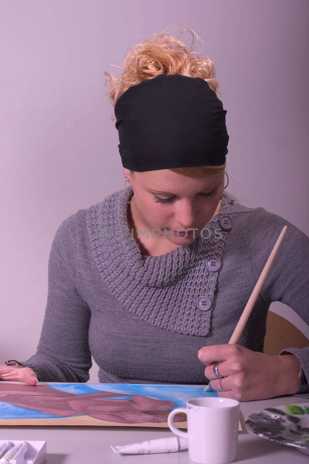 High school student painting a female nude