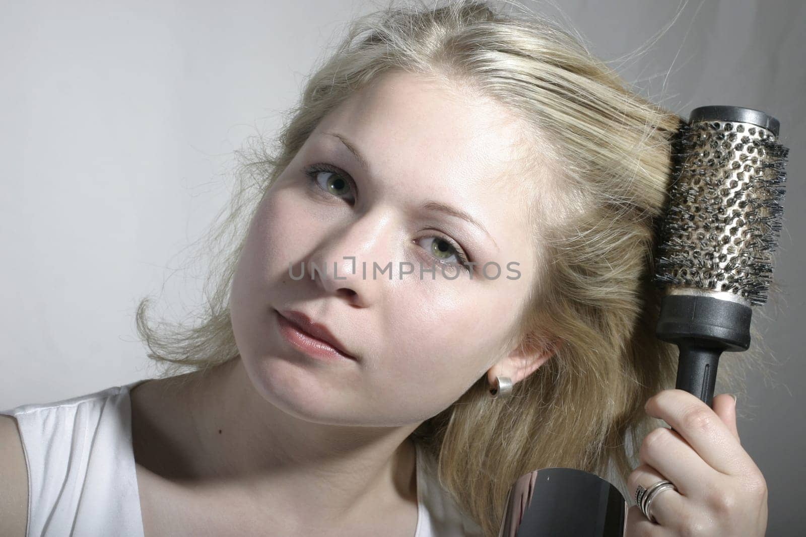 Blow-drying hair with a brush