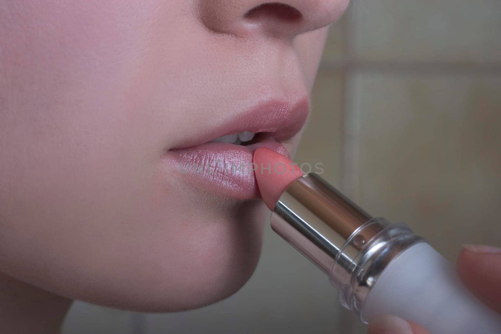 Applying lipstick