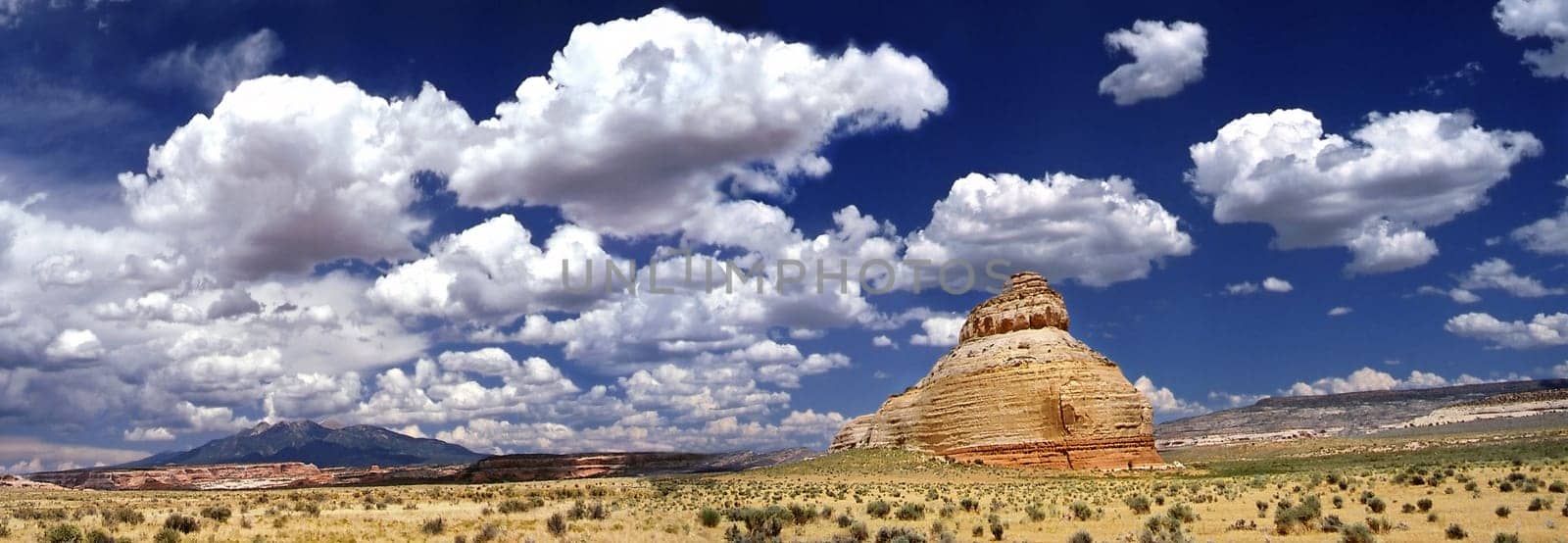 This panoramic shot (2 slides assembled with polarizing filter photographed) Originated during my first USA vacation 1988 near the Arches NP on the drive to Salt Lake City.