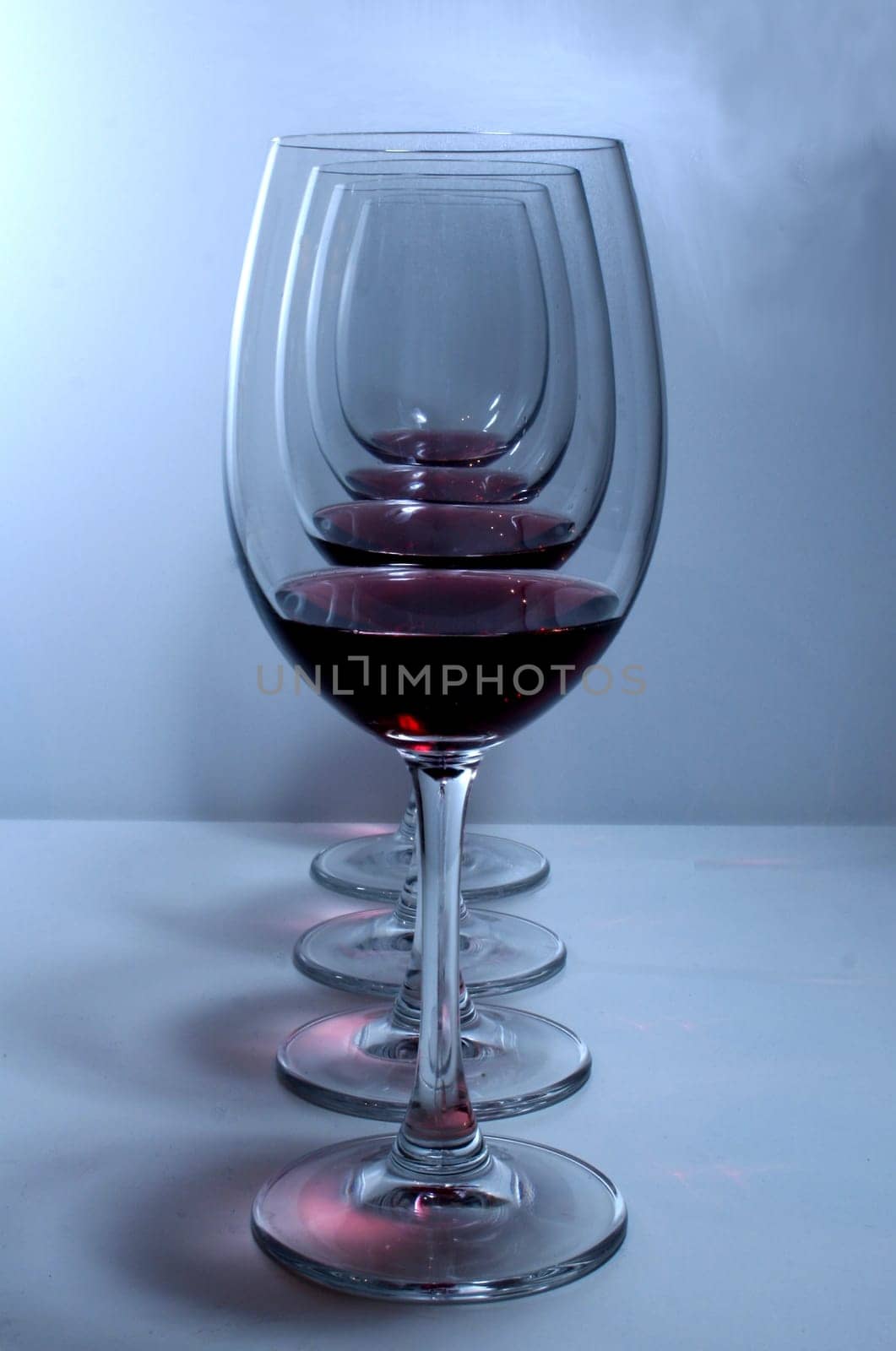 almost empty red wine glasses,in a row