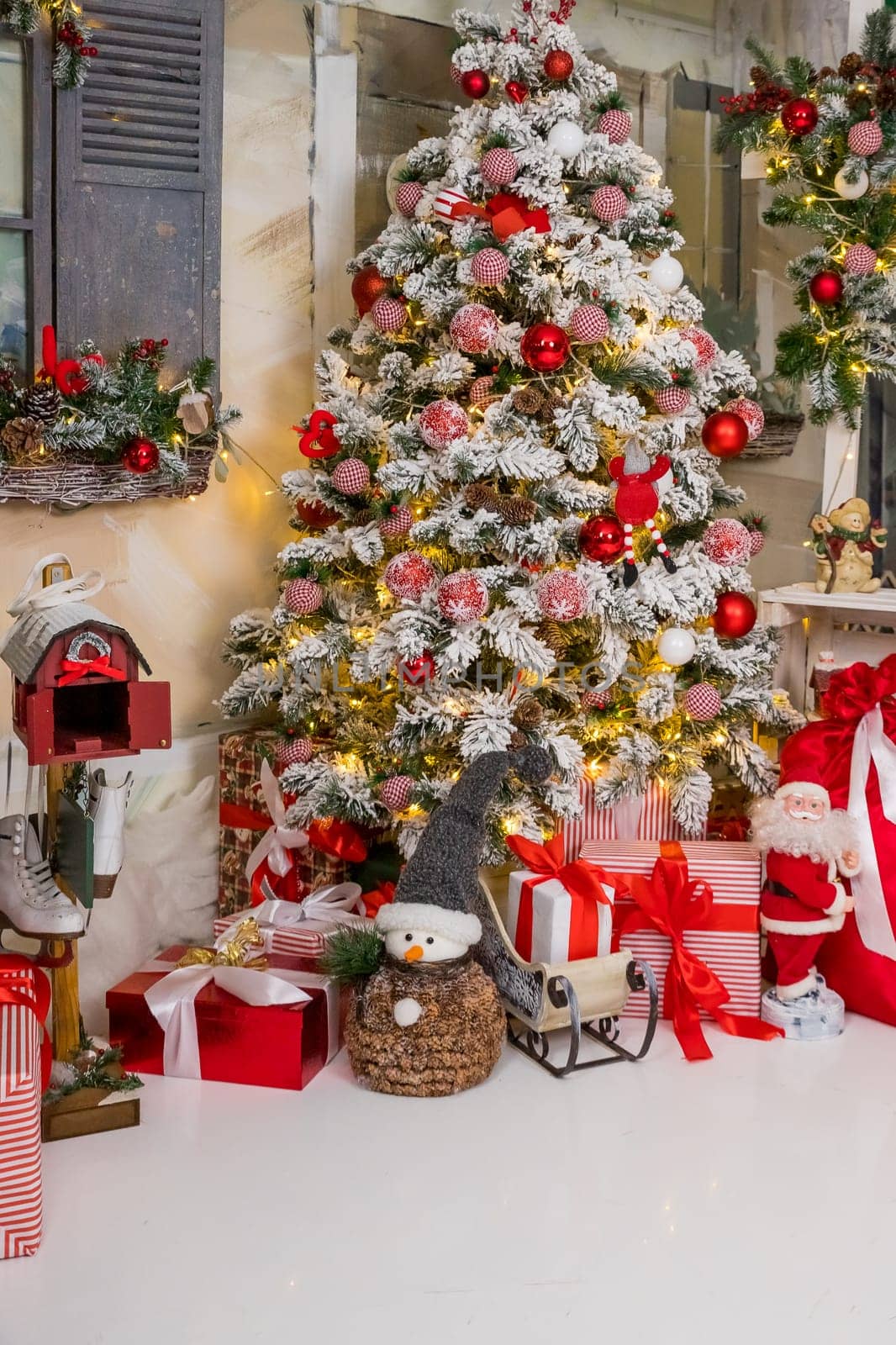 Christmas decorations. Christmas background. Beautiful holiday decorated room with Christmas tree with presents under it