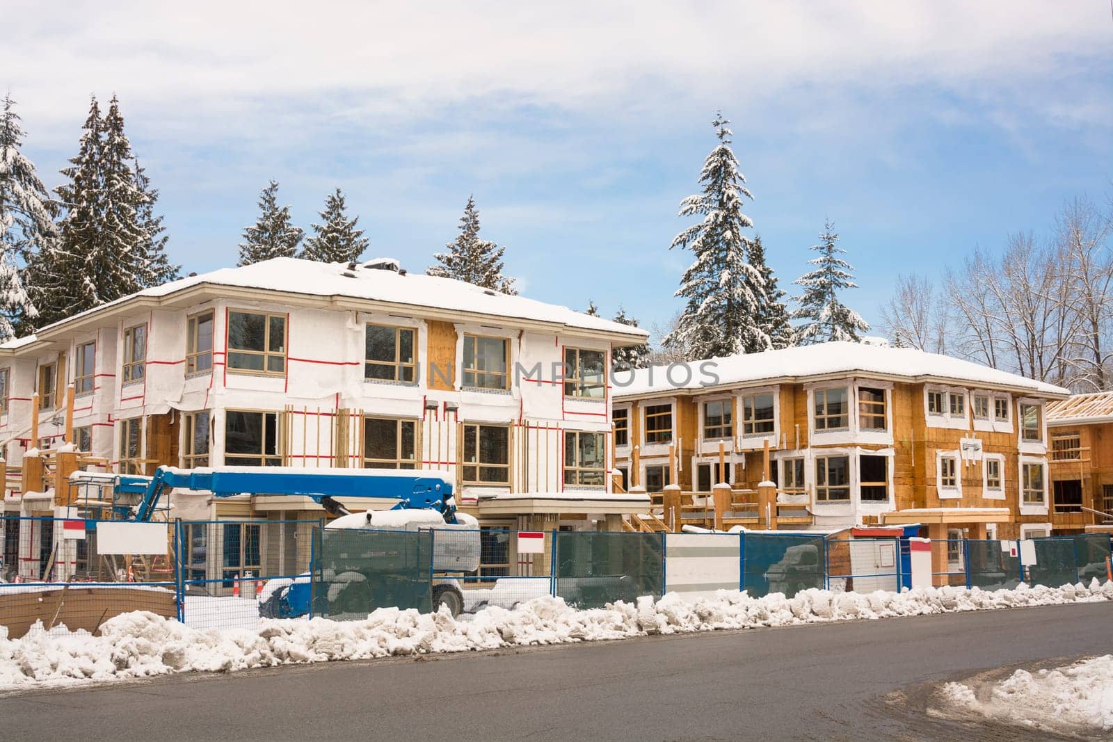 Townhome complex under construction in snow on winter time