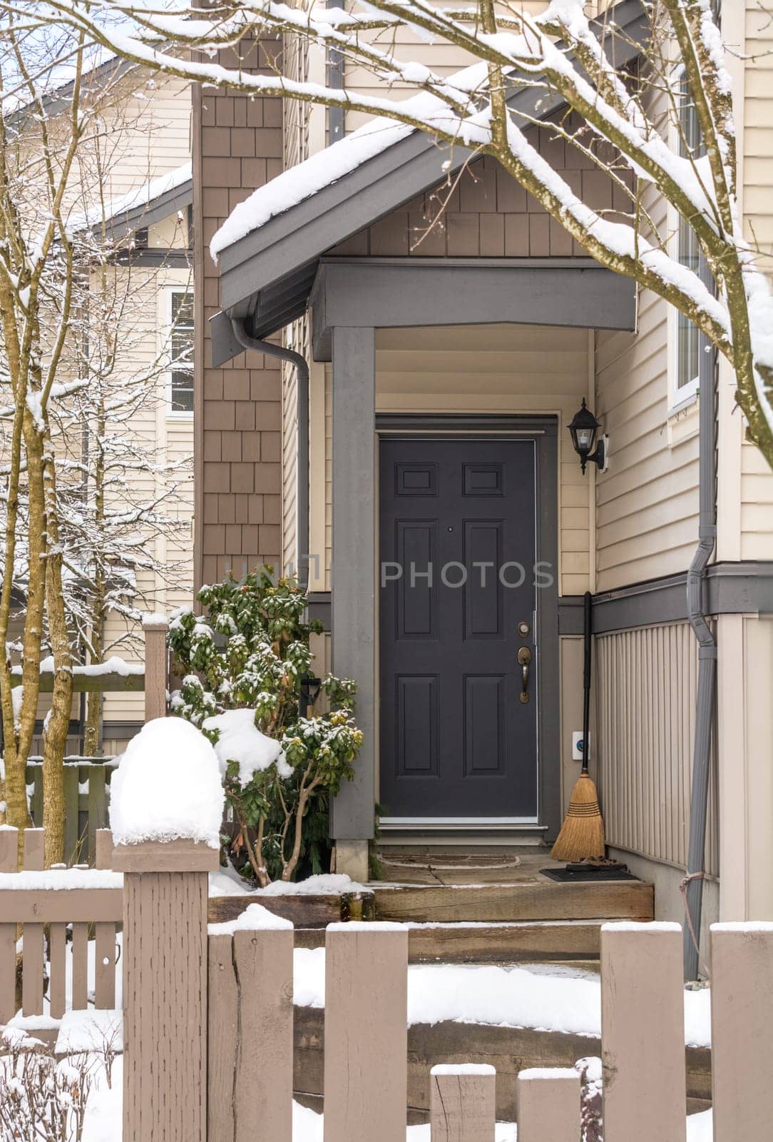 Entrance door of residential townhouse on winter time