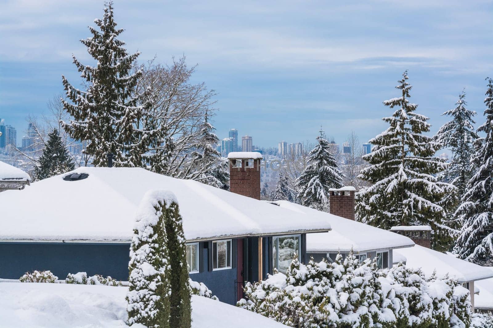 Street of residential houses in suburban of Vancouver. Family houses in snow on winter season