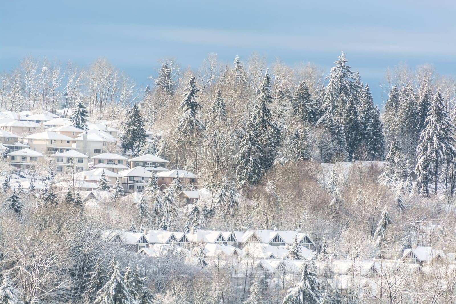 Suburban in the snow. Residential houses in snow on bright winter day in Canada