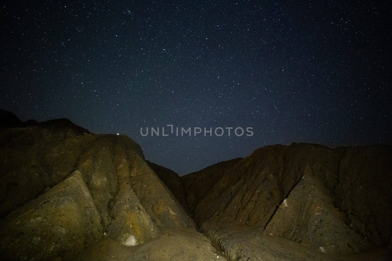 night sedimental mountains at starry night.