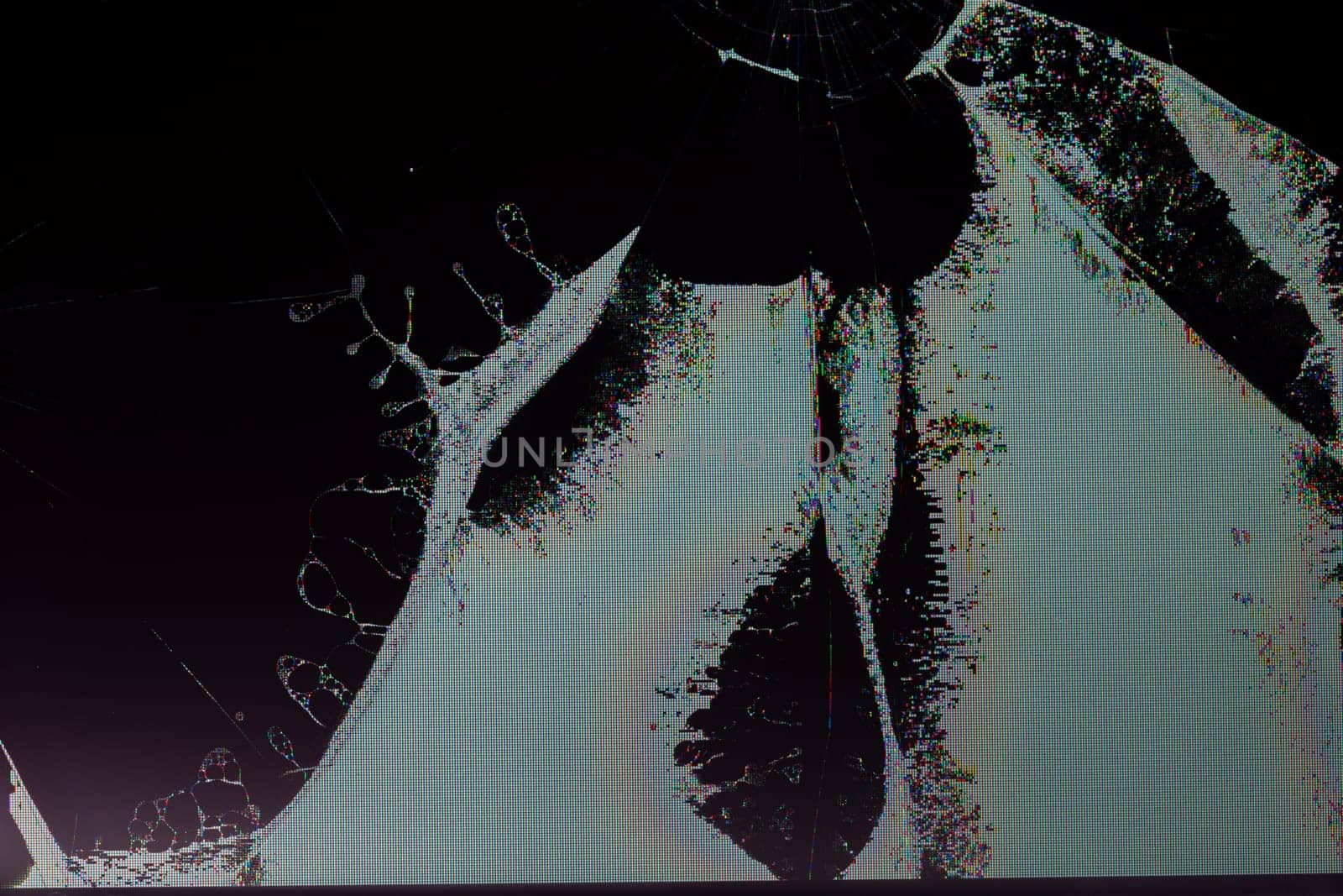 broken lcd tft tn screen flat macro texture with crystal leakage and physical damage cracks, closeup with selective focus and blur.