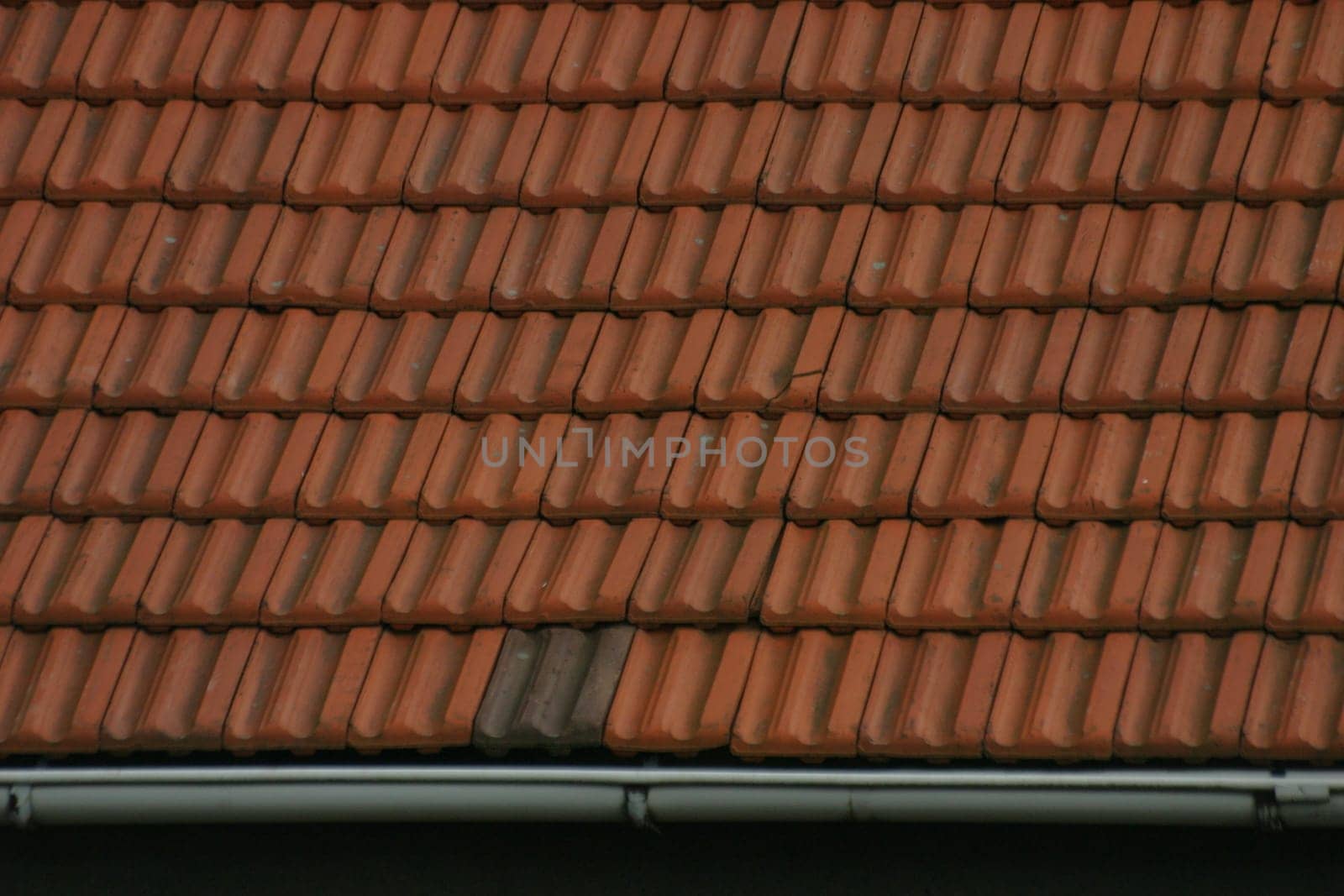 House roof covered with red tiles