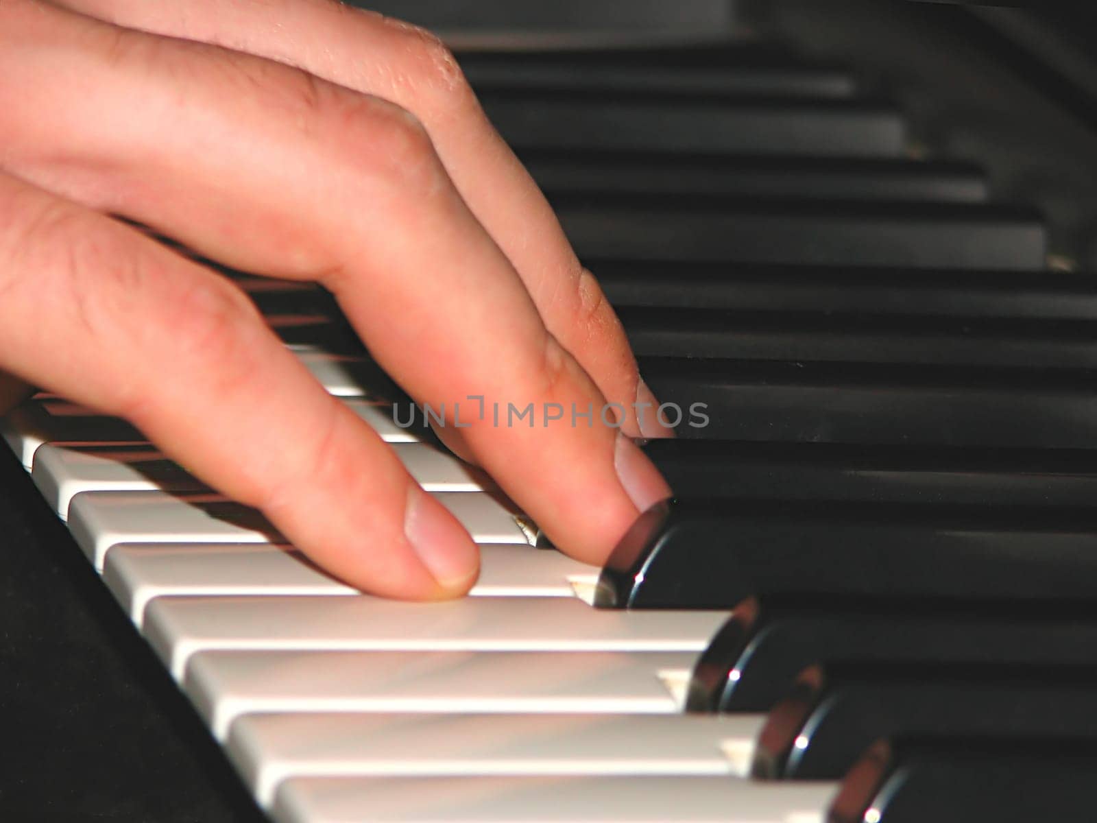 Finger play on the keys of a keyboard