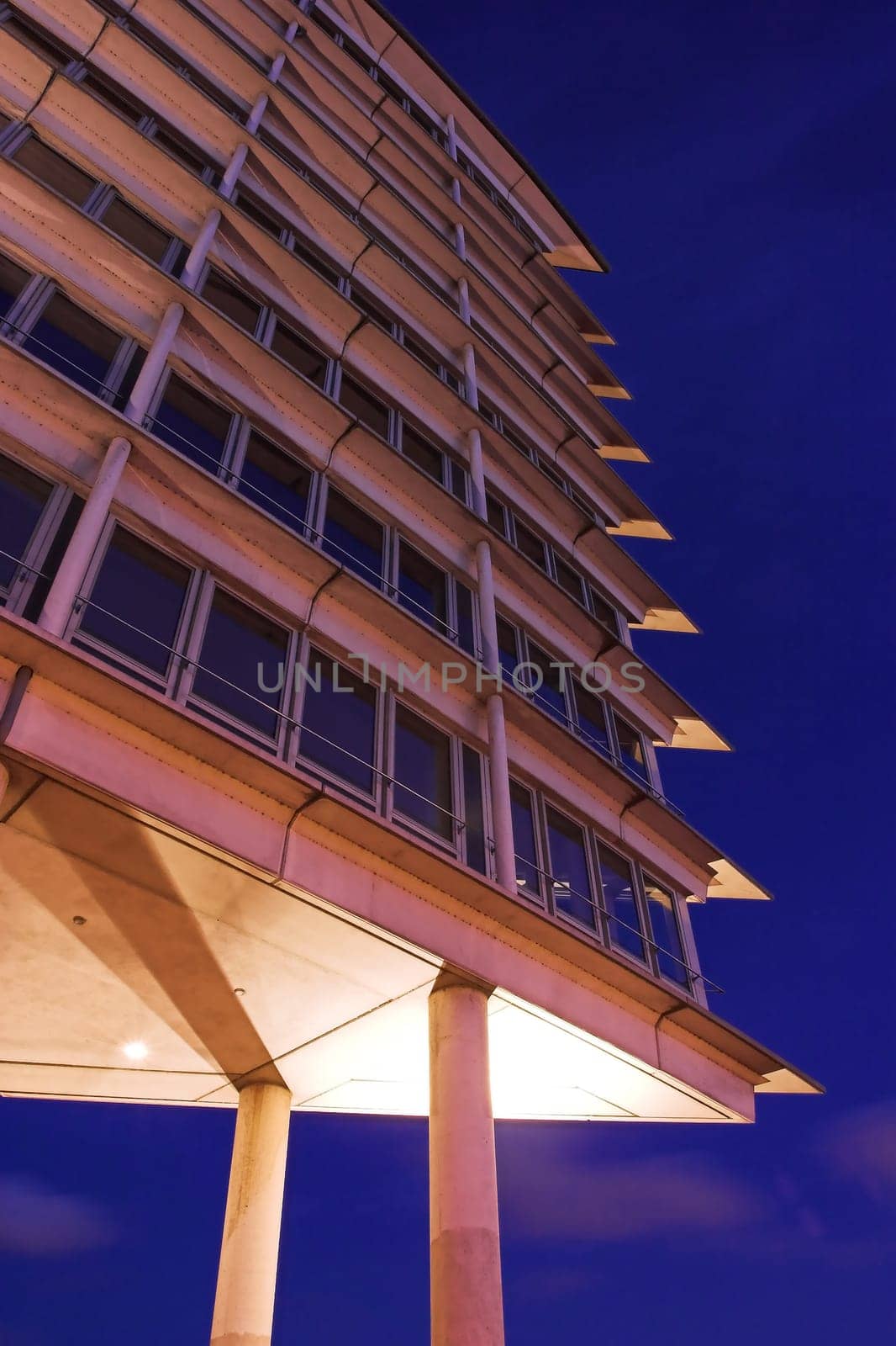 Night shot of a high-rise office building at the port of Hamburg