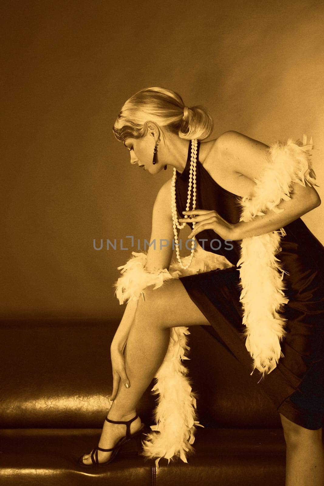 A woman in the style of the 20s stands with one leg on the sofa. Image has been edited in yellow cast