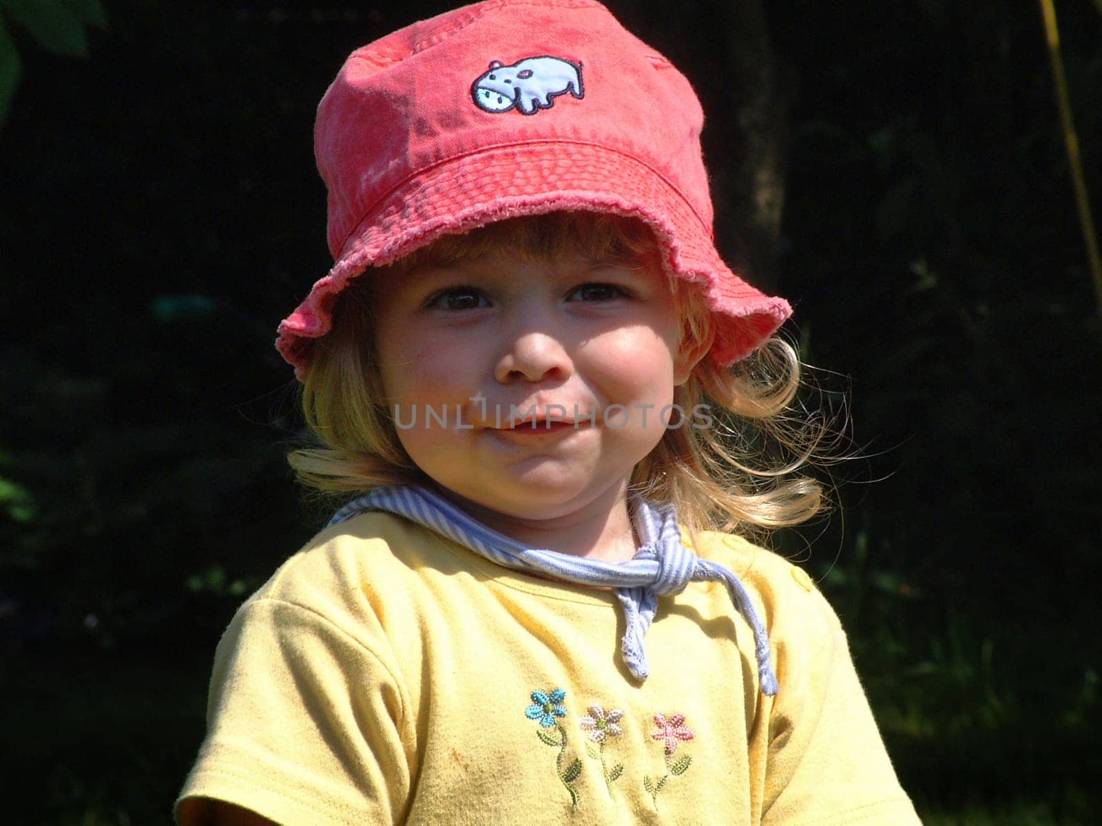 My youngest granddaughter in our garden