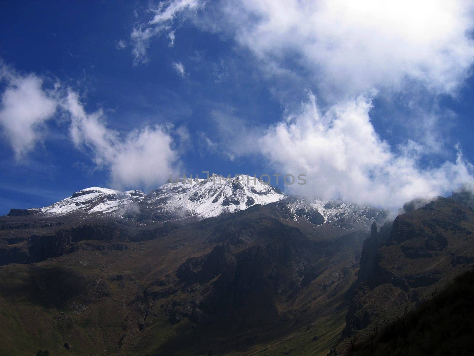 Iztaccihuatl,the sleeping one,sister mountain of the Popocatepetl,is an extinct volcano of 5300 m near Mexico CIty