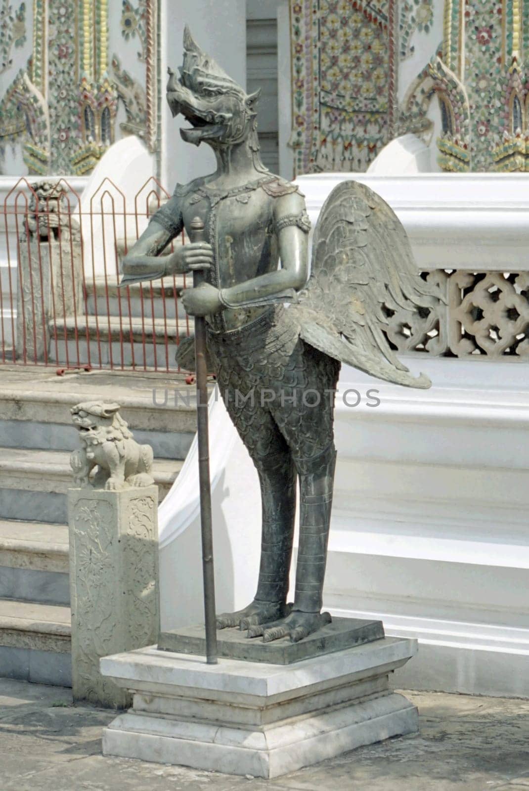 Photo of the "Nok Tuntima"",a Thai mythical creature consisting of man and bird. Photographed in the temple complex of Wat Phra Kaeo in Bangkok.  Scan from the negative"