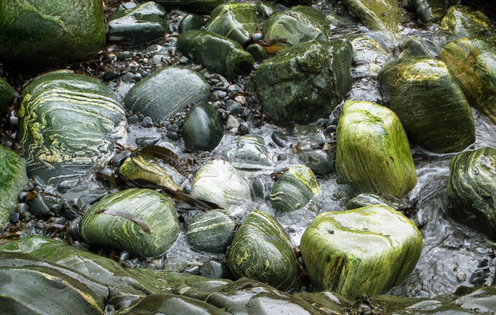 This picture was taken during a walk on the beach in Norway. Due to the water constantly washing around the stones,quite pretty shapes and colors are created over time