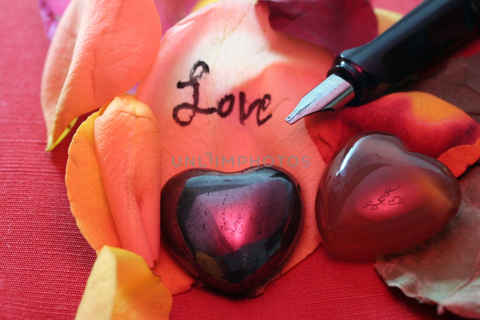 Love greetings on rose petals
