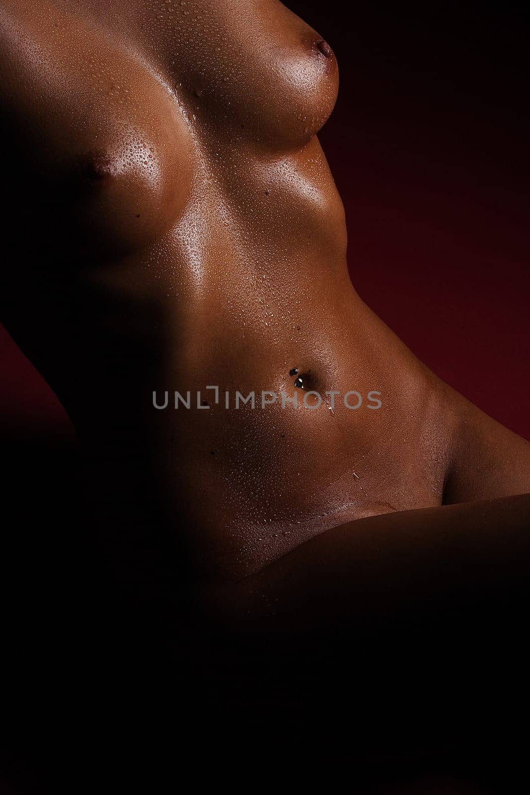 The photo shows a woman's body,wrapped in water droplets.