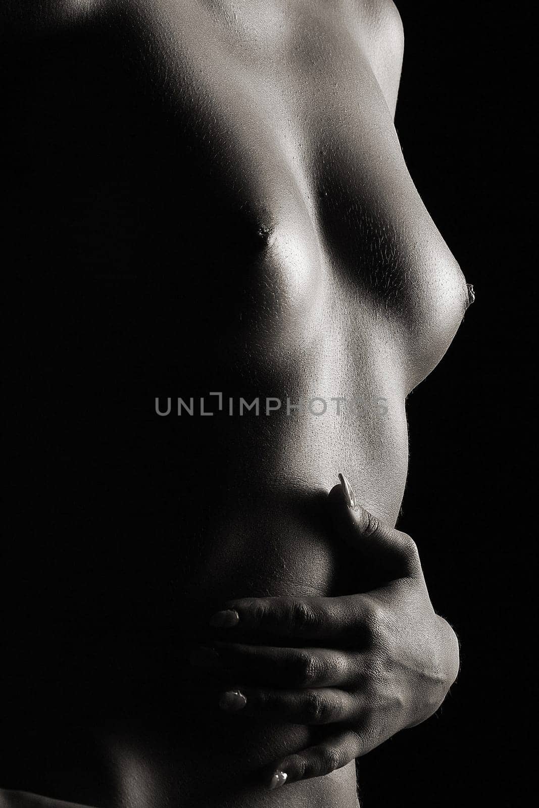 Beautiful low key shot shows a woman's body