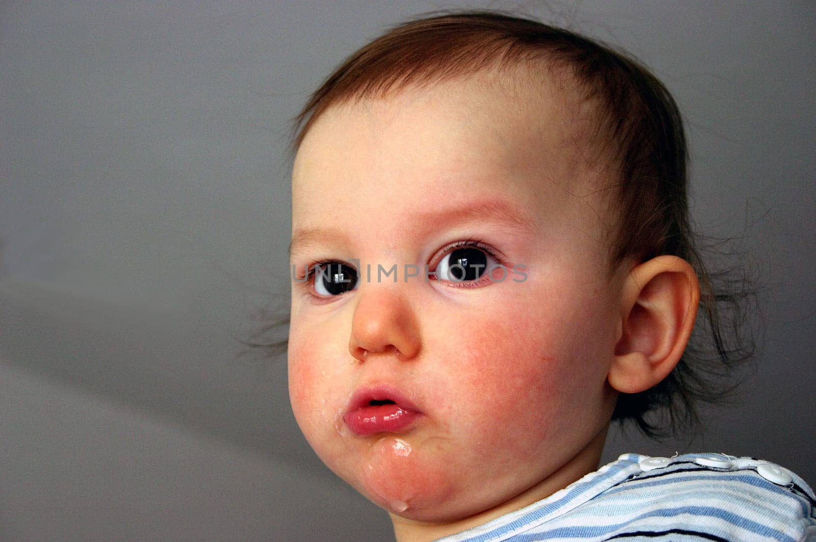 Levy,my niece's son,looks with his big,brown eyes and pulls a snout...