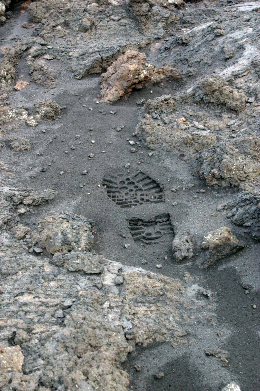 Footprint in the ashes of Mount Etna near Zafferano (Sicily)