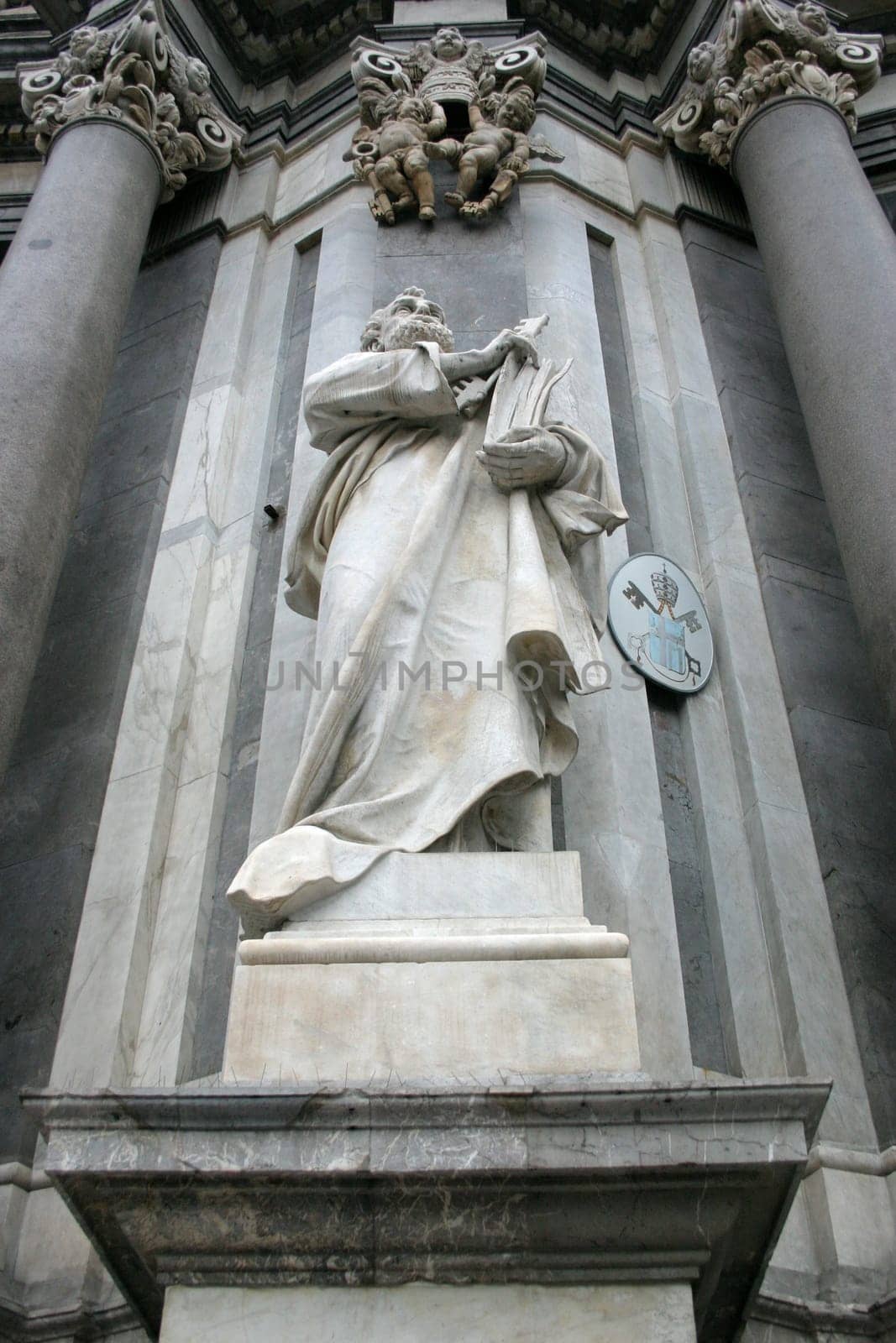 Statue of a saint on the façade of the cathedral in Catania