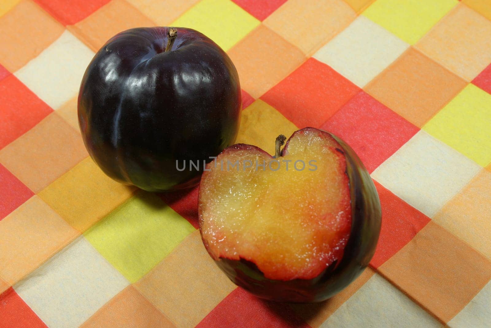 Plums on a checkered support