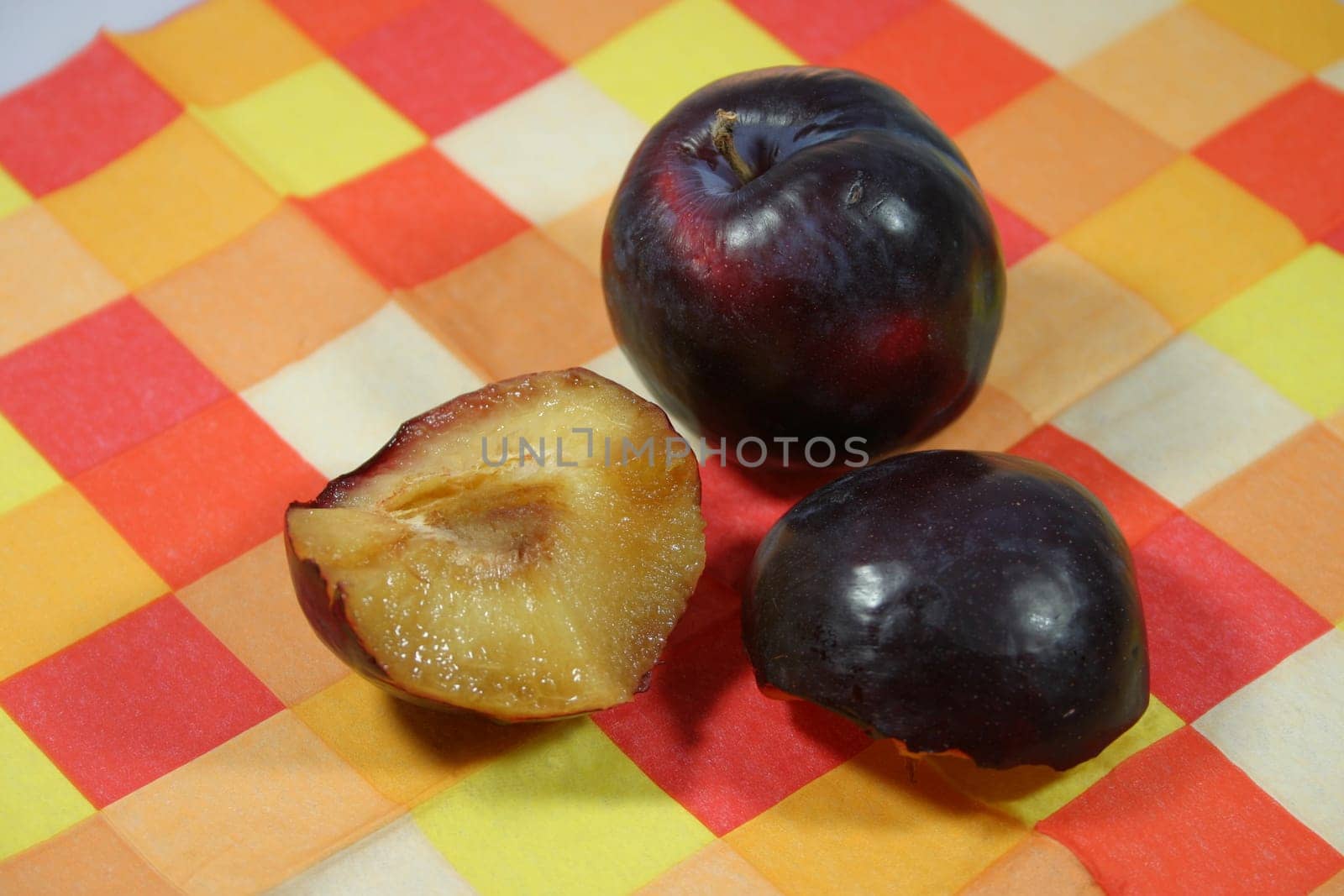 Plums on a checkered support