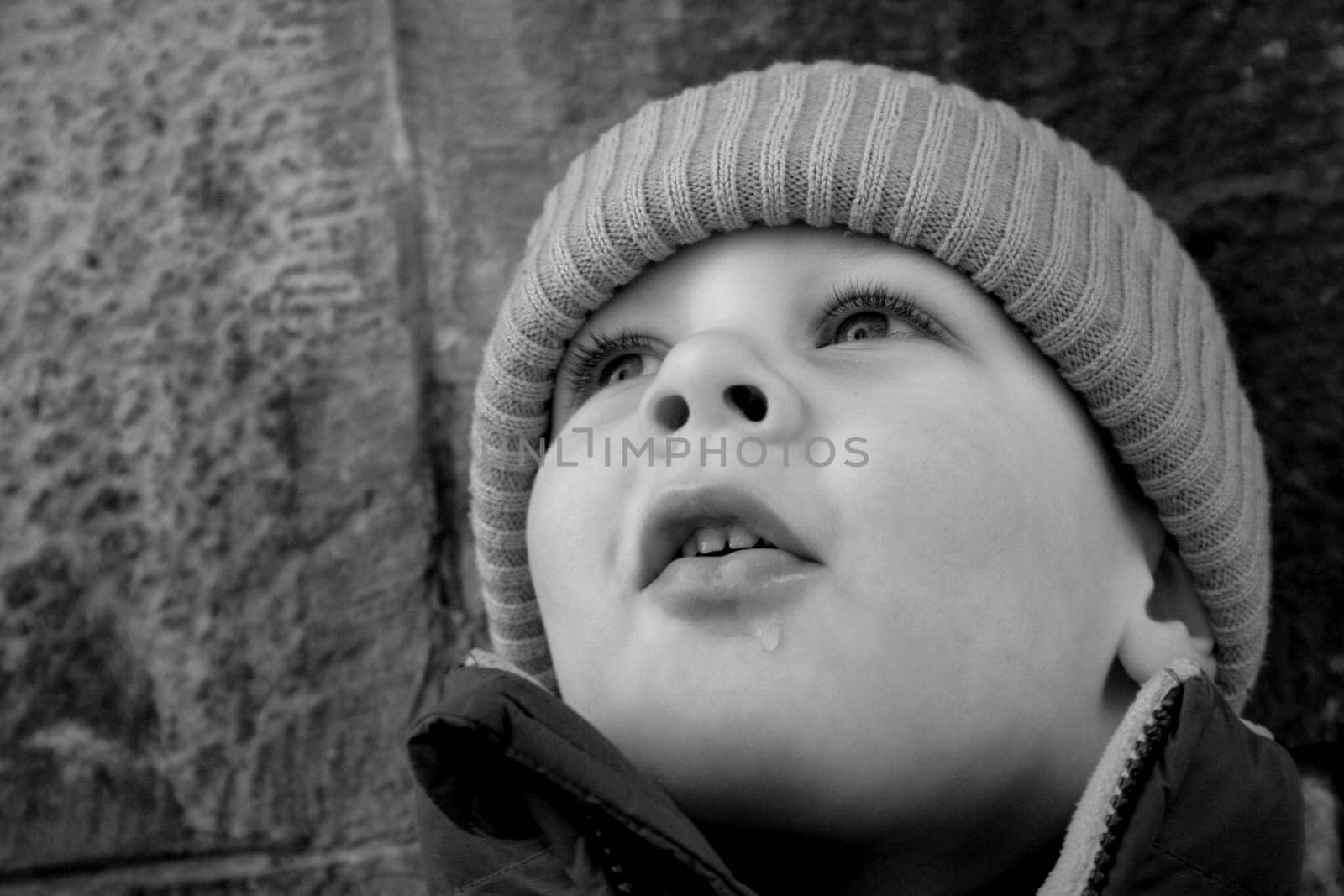 The drop on his chin comes from a snowball that he melted with his mouth. No,the snow wasn't yellow  -)