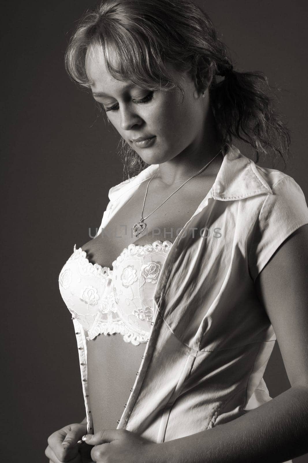 Woman shyly looking down