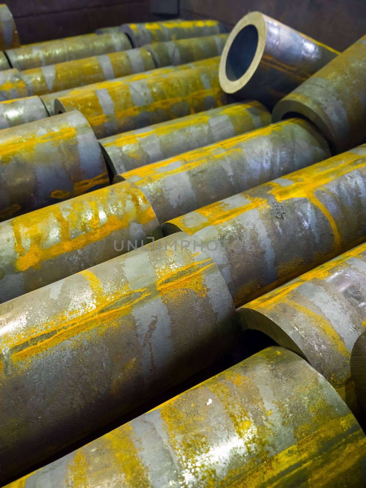 rusted thick steel pipe chunks after sawing waiting for machining operations by z1b