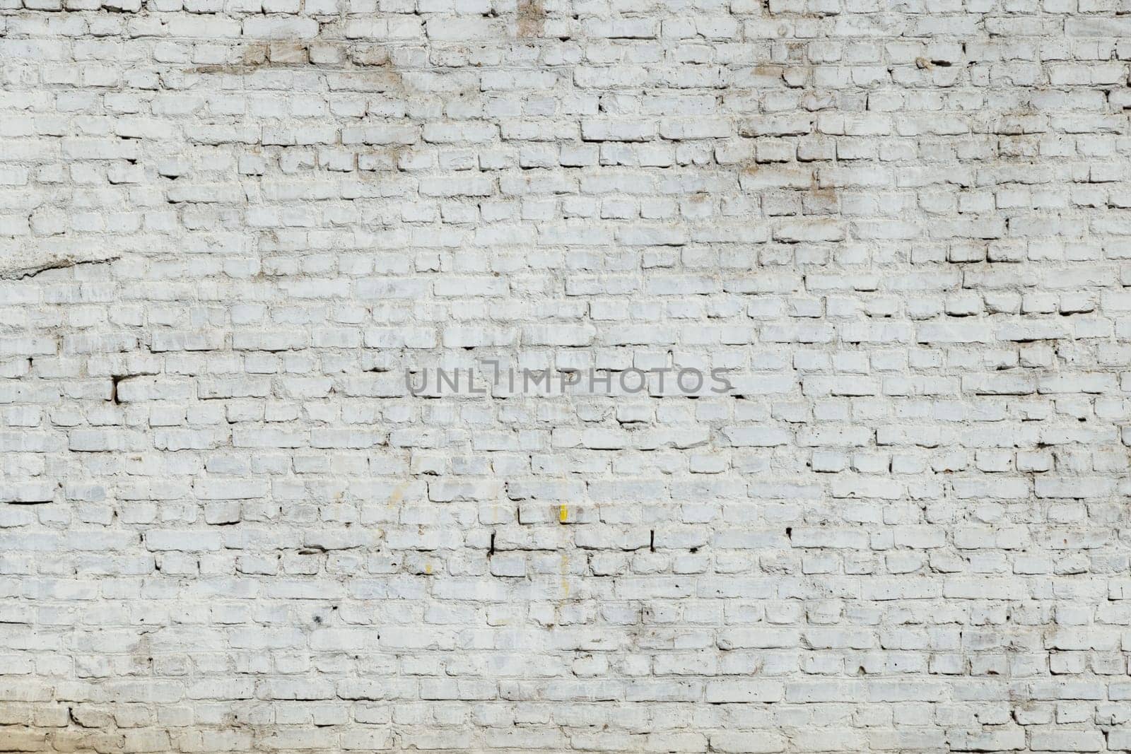 old dirty white painted brick wall, full-frame flat background and texture