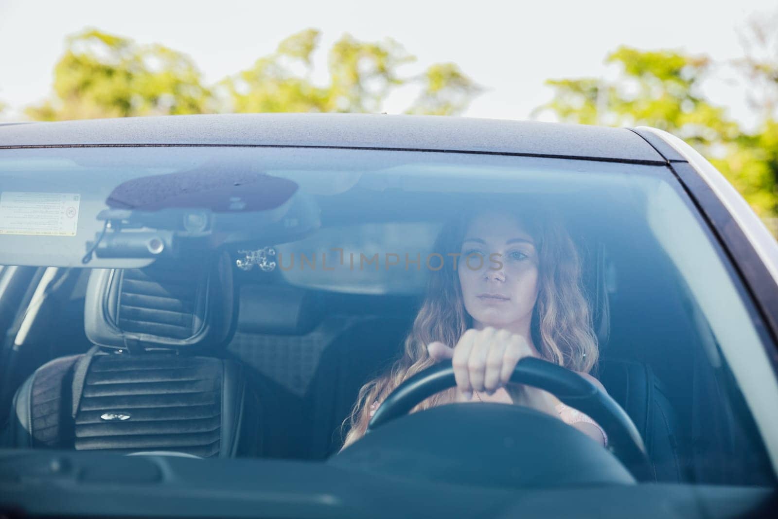 woman behind the wheel of a car car lady motorist trip