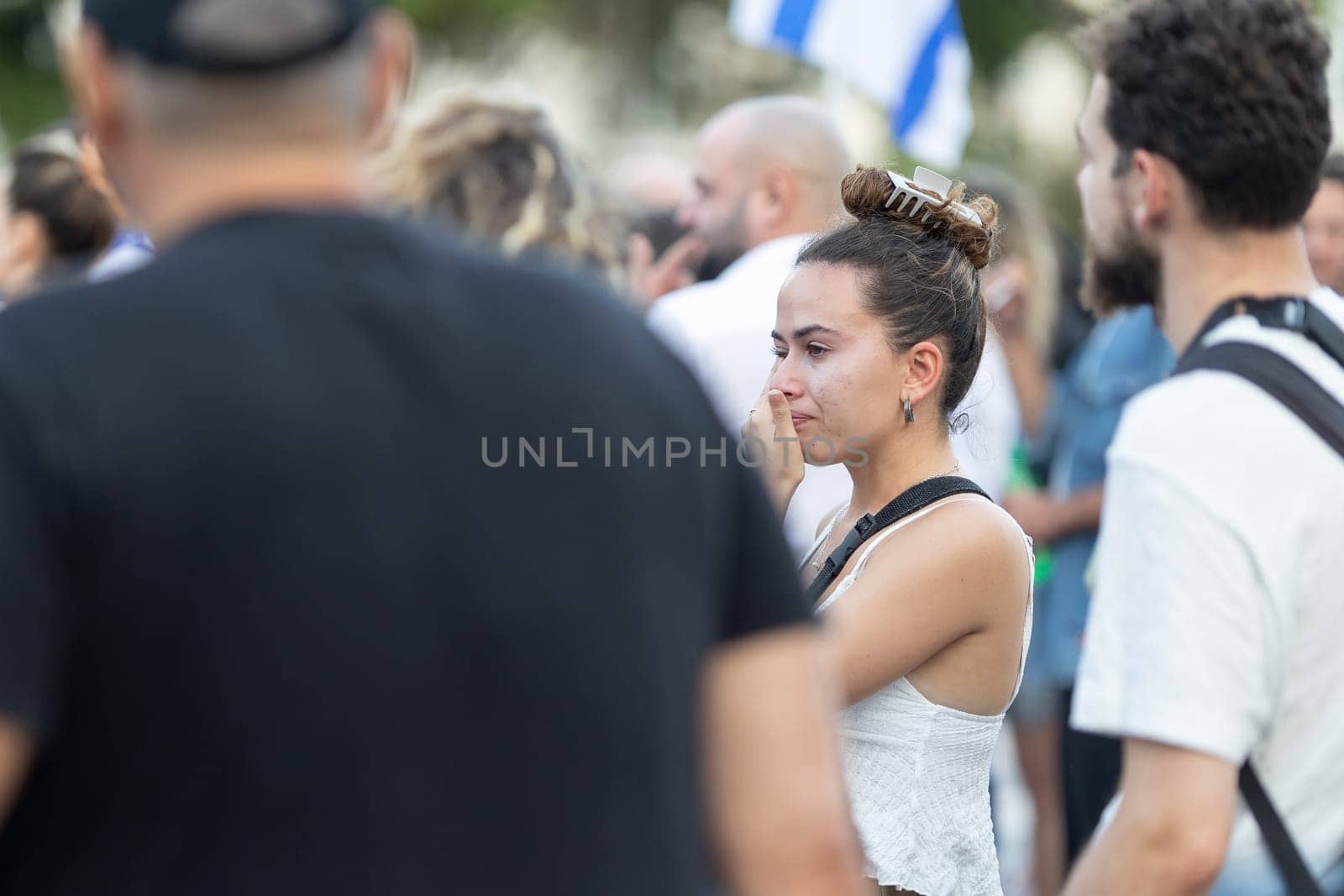 Lisbon, Portugal, October 10, 2023, A woman cries at a rally in support of Israel. Mid. shot