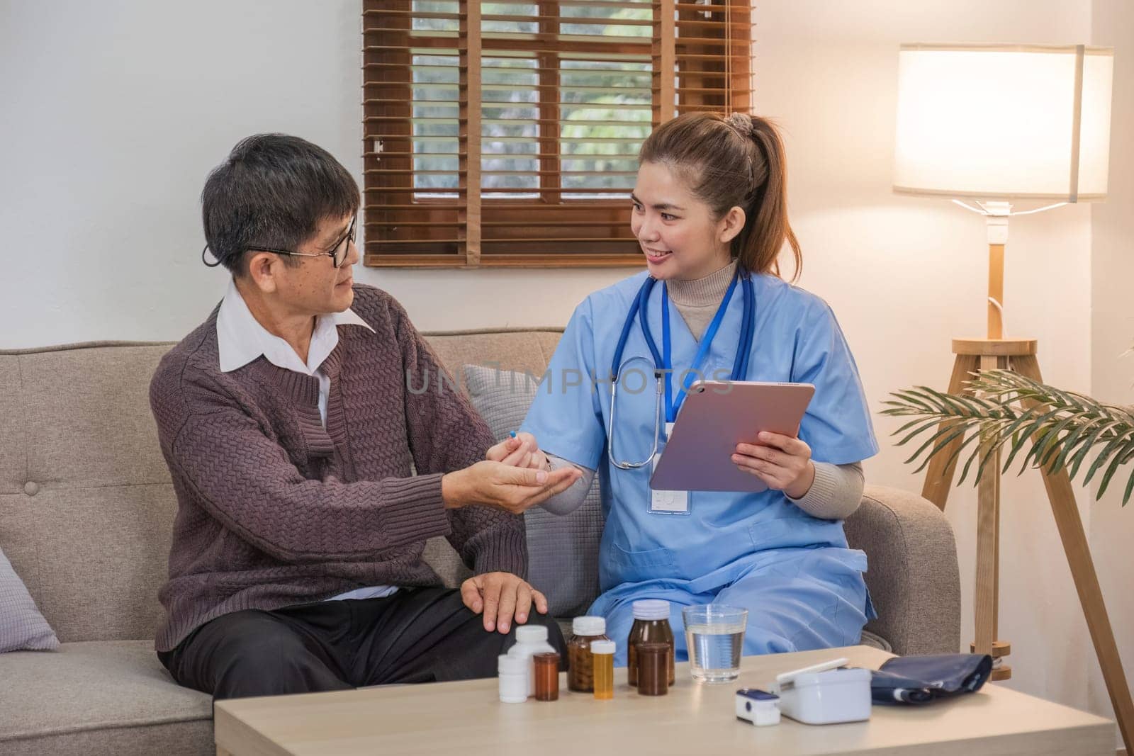 Nurse, hands and senior patient in empathy, safety and support of help, trust and healthcare consulting. Nursing home, counseling and gratitude for medical caregiver, client and hope in consultation by wichayada