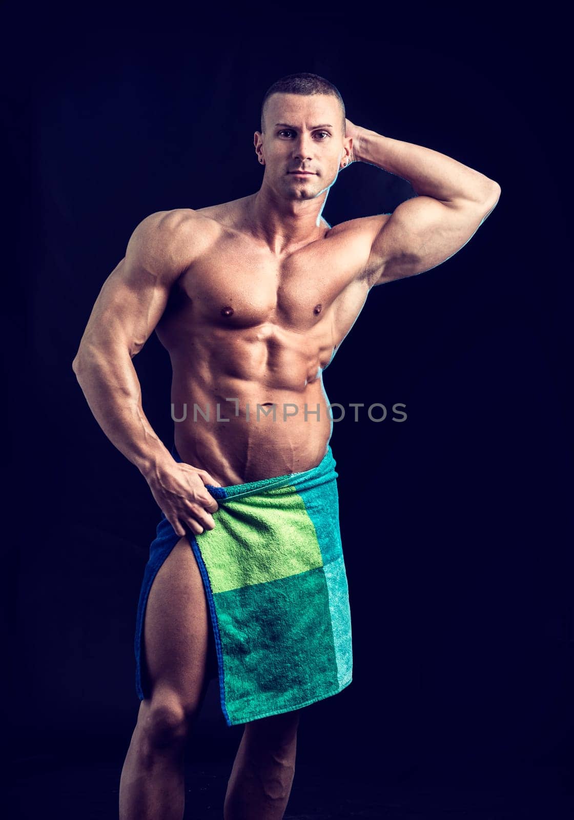 Photo of a shirtless man with a towel around his waist by artofphoto