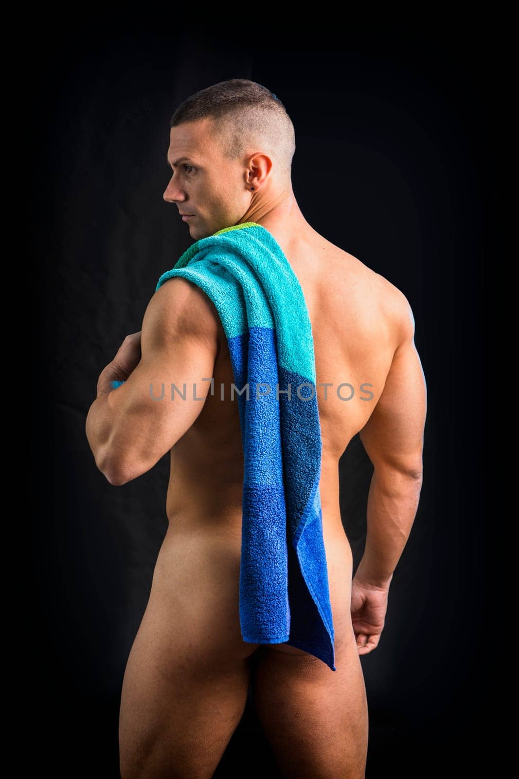 Photo of a shirtless man with a towel on his shoulder by artofphoto