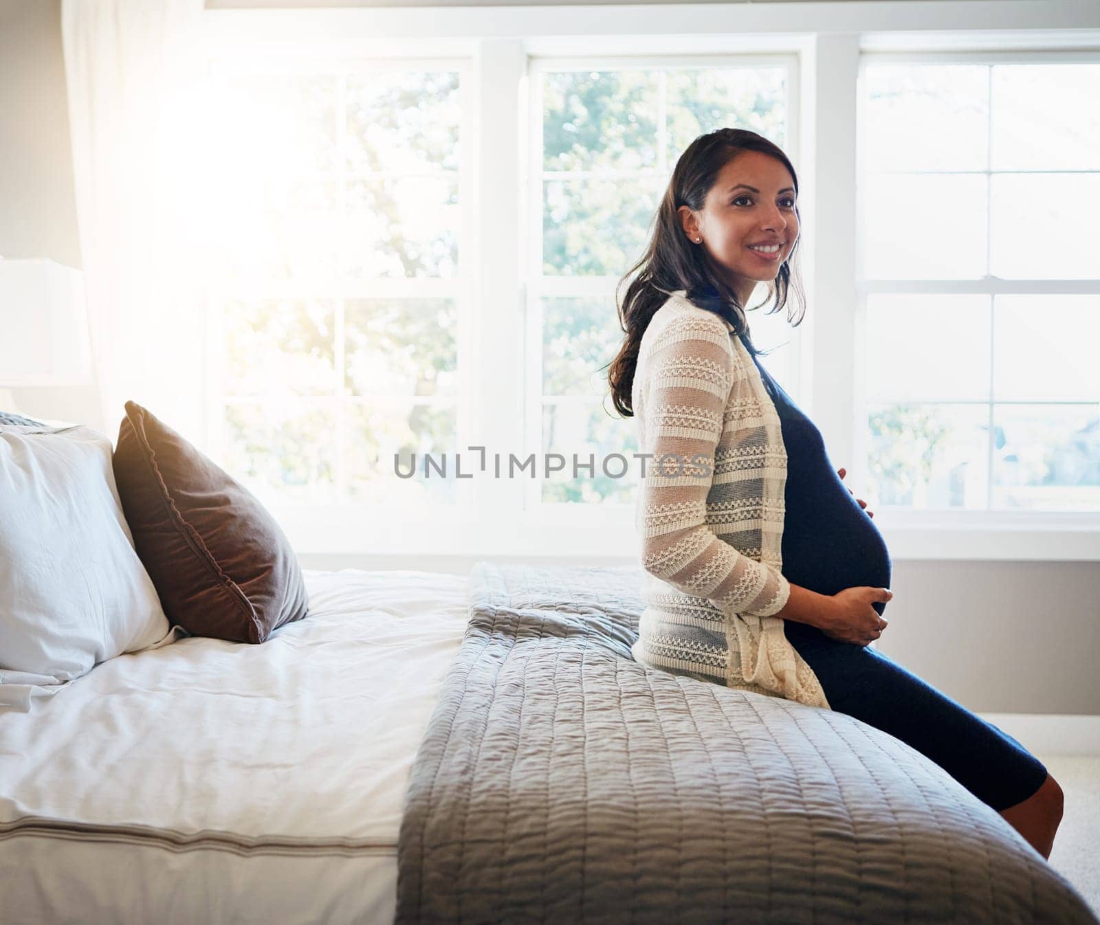 Home bedroom, happiness and woman pregnancy, massage stomach, abdomen or mom happy for baby development. Mama expectation, bed and pregnant mother smile, maternity and hope for future life growth.