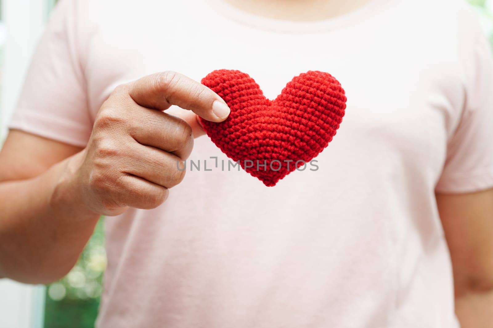 Asian woman holding human internal organ model, donation charity volunteer concept. 