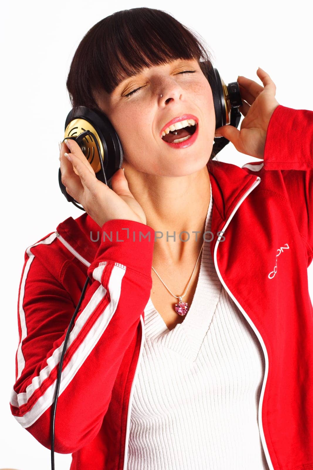 A woman with headphones singing