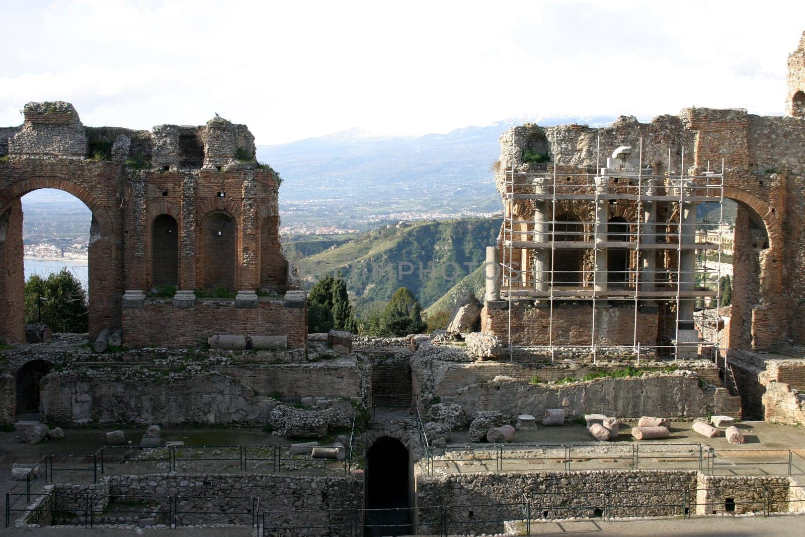 Goethe called the Teatro Greco "the most beautiful theatre in the world"". Here,unfortunately,Mount Etna is hidden in the haze in the background."