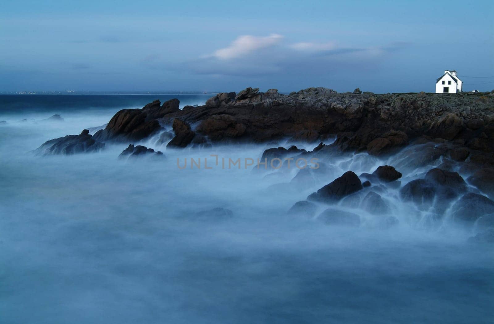 Long exposure of a rock formation in Brittany (France) at the blue hour