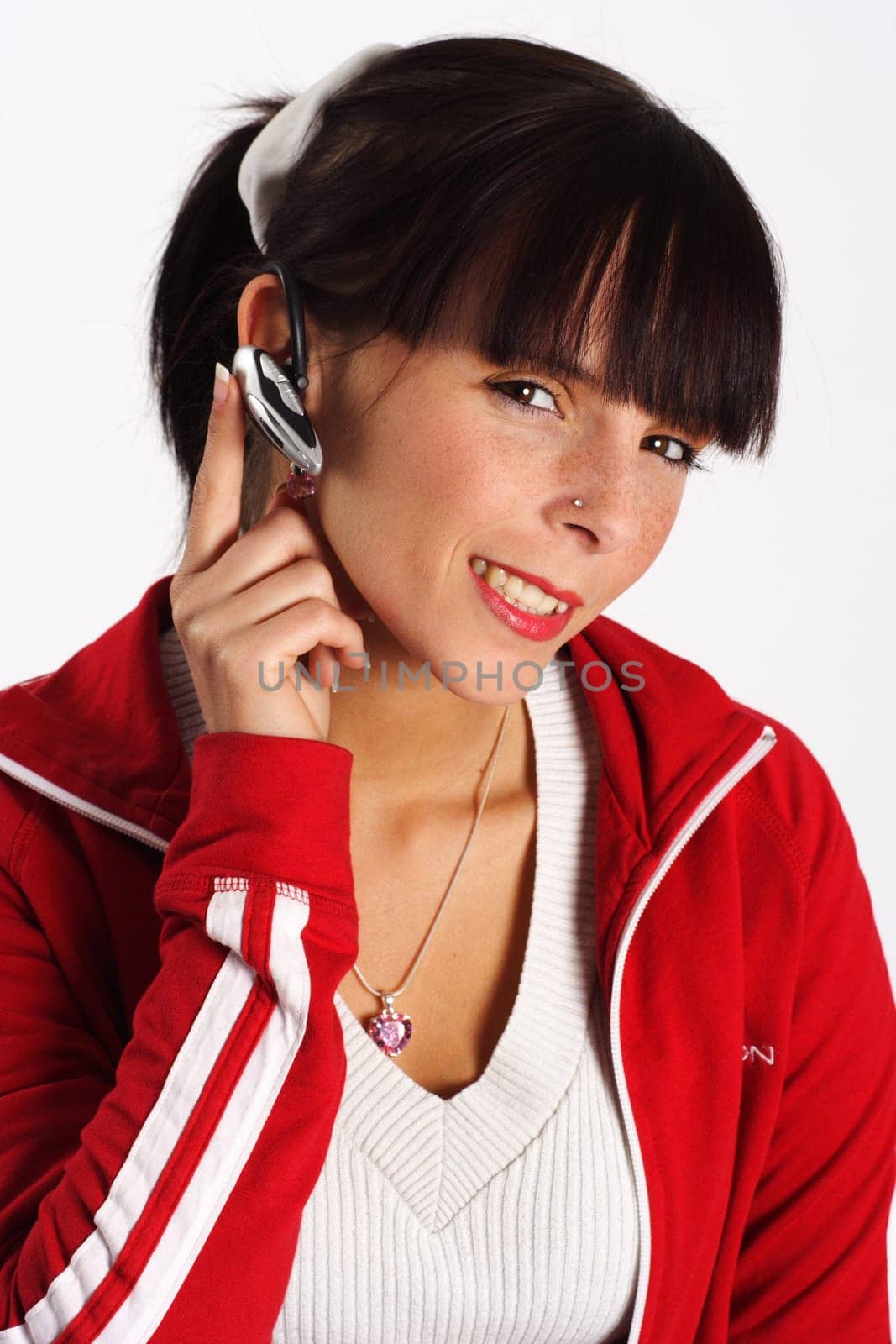 This is shown by a young woman with a headset