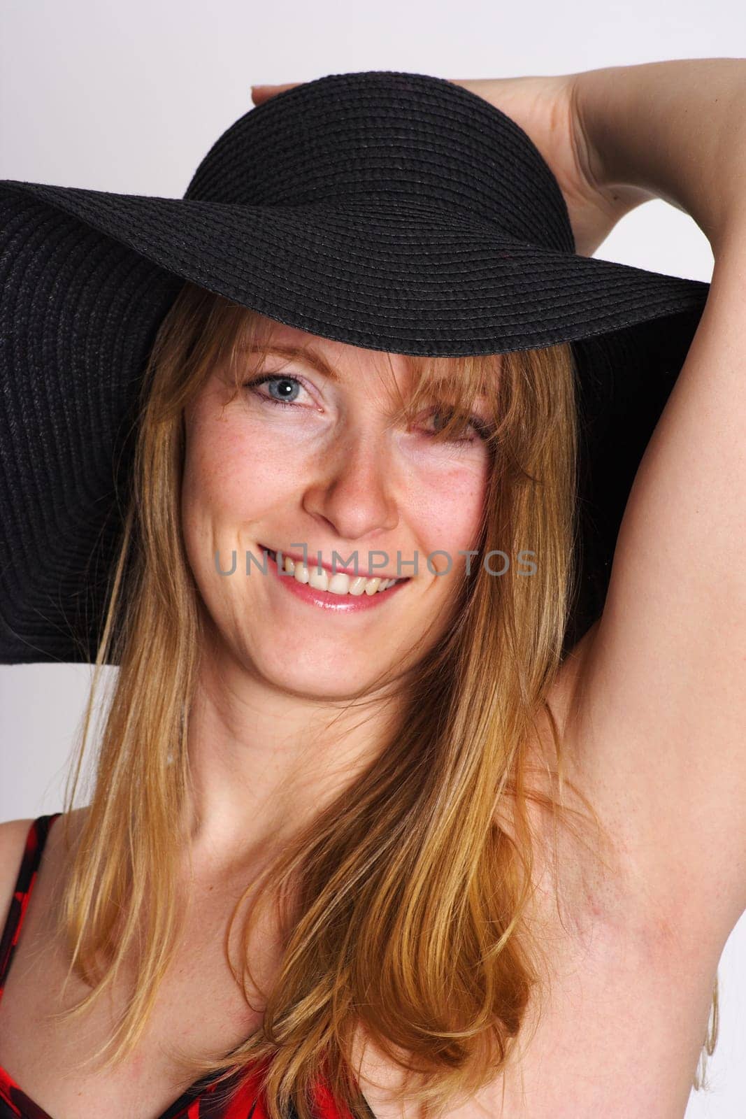 Photo shows a woman wearing a hat.