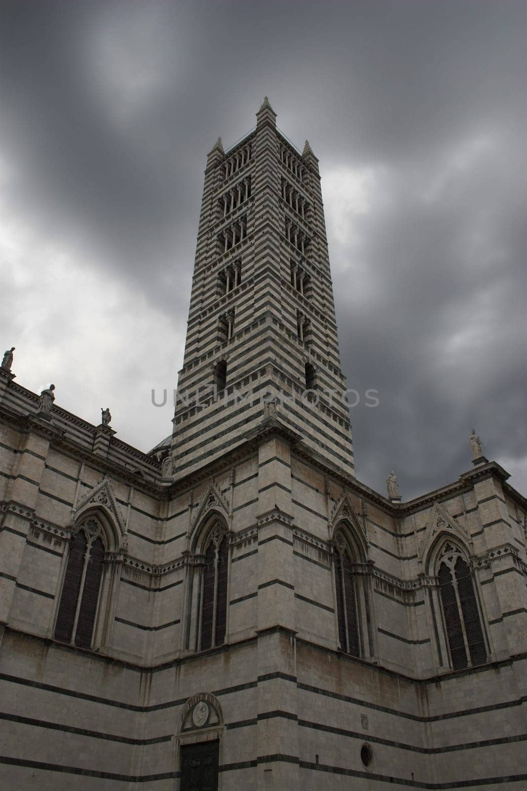 The Cathedral of Siena just before rain. Blue skies are beautiful,but there's also something about this picture  -)